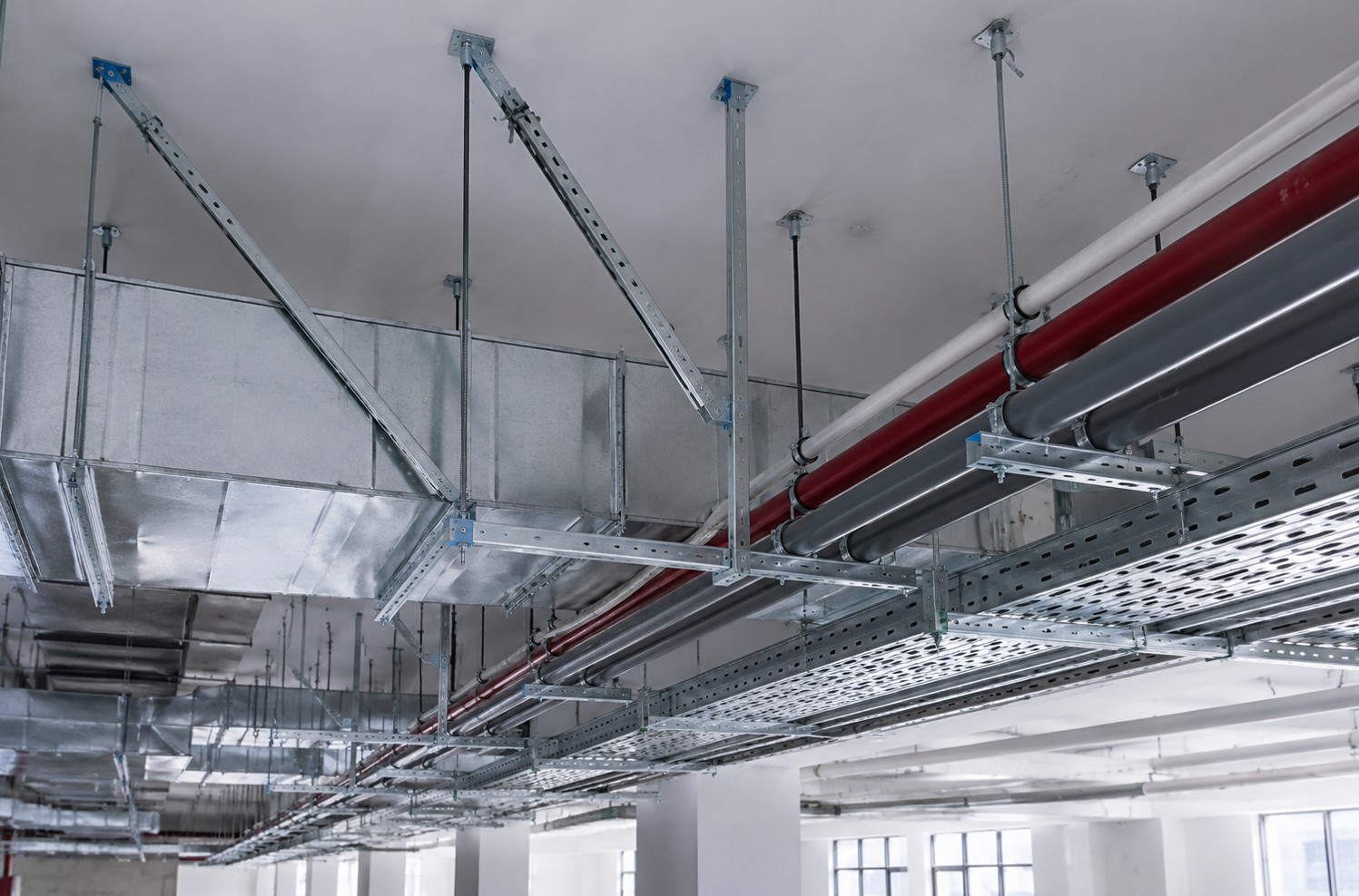 Seismic support for MEP services at a building ceiling